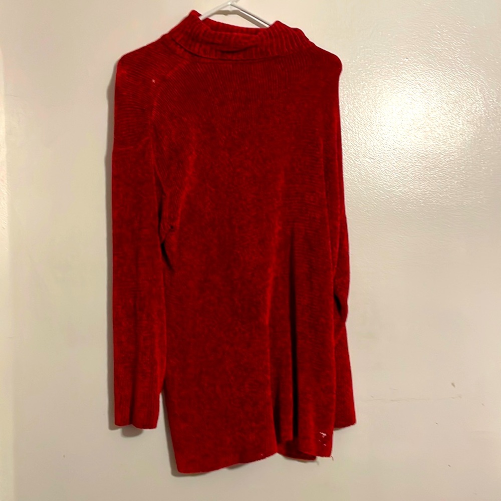 A very nice holiday sweater, has a knitted corduroy texture .